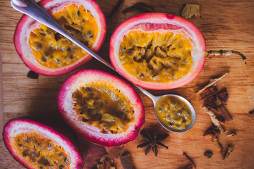 passion fruit pulp and seed board, spoon, spices