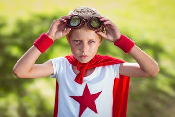 Little boy pretending to be superhero