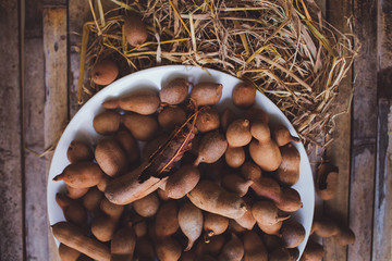 Tamarindos (tamarinds) on plate kitchen table