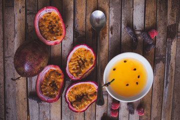 passion fruit pulp and seed board, spoon, candied fruit, plate w
