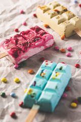 Tasty summer popsicles with candies