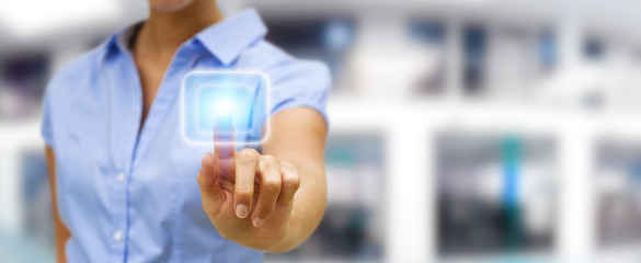 Businesswoman touching modern tactile screen button