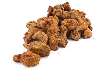 Heap of domestic salty fried pork greaves, cvarci, isolated on white