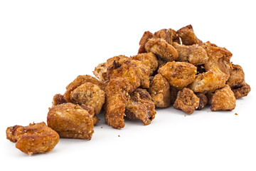 Heap of domestic salty fried pork greaves, cvarci, isolated on white