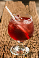 Viewed from the top red wine in a glass timber on the floor vint
