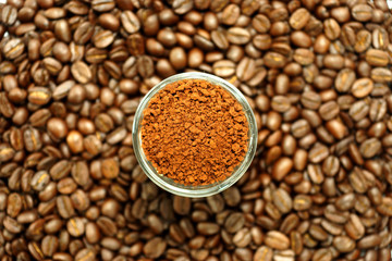 roasted coffee beans and coffee powder in the glass.
