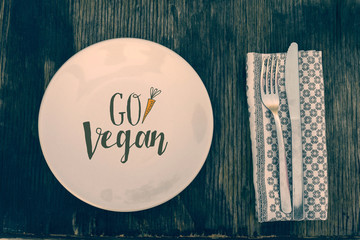 Go vegan text healthy eating on rustic wood table - 108639763