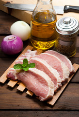 Meat, pork, slices pork loin on wood