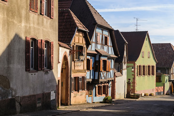 Half-timbered houses on a narrow street of St. Hippolyte, Alsace, France