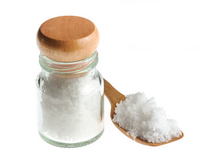 white salt in wooden spoon