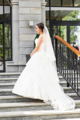 Young bride in wedding dress outdoors