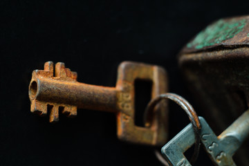 Rusty old key  on dark background