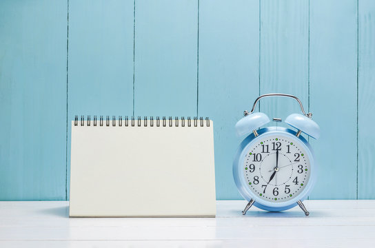 Blank desk calender with vintage Alarm clock