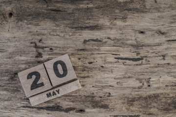 template with cube calendar for may on wooden surface with copy space