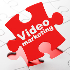 Advertising concept: Video Marketing on puzzle background