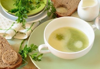 Рea and potato soup with cream in the shape of a Yin-Yang symbol in the bowl