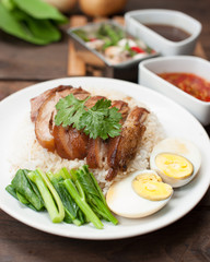 Thai stewed pork leg with rice on wood(Kao Kha Moo)