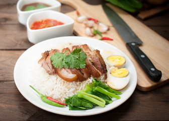 Thai stewed pork leg with rice on wood(Kao Kha Moo)