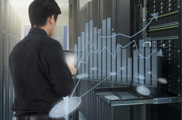 Man working in data center and use tablet for analyze system
