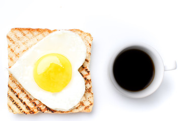 Fried egg on toast fried egg on top.Morning breakfast.Nice breakfast.Eggs in a heart shape