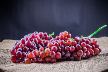 red grape on burlap cloth