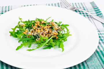 Arugula Salad with Germinated Grain in White Plate