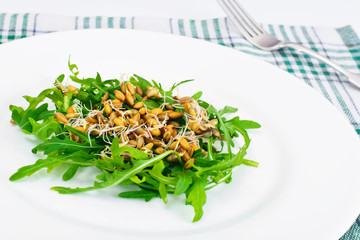 Arugula Salad with Germinated Grain in White Plate