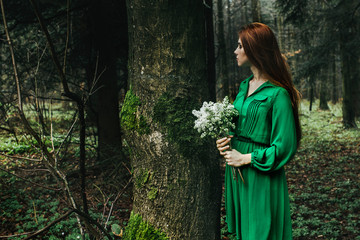 woman in green dress with flowers