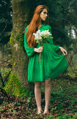 girl in green dress in forest