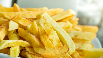 Hot fresh French fries in the plate