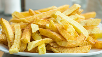 Hot fresh French fries in the plate