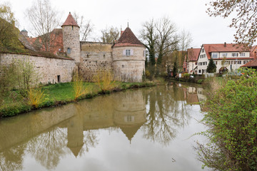 Naklejka na ściany i meble Old city wall with tower in spring
