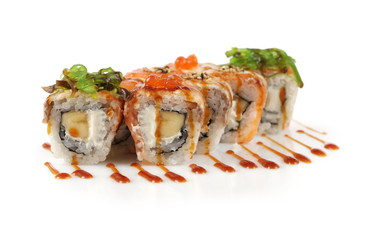 Sushi rolls with banana, salmon, eel fish, wakame seaweed, red c