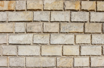 Naklejka premium tło - mur z cegieł piaskowca
