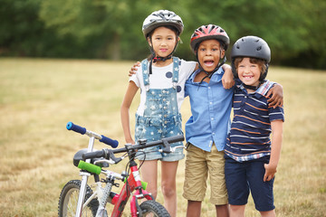 Group of children with bike and scooter