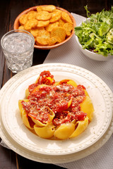 Lumaconi pasta with tomato sauce, bruschetta and salad