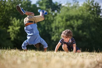 Foto op Plexiglas Two kids making a somersault © Robert Kneschke