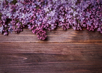 lilac flowers on an old wooden board