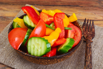 Healthy and diet food: Lettuce, tomato, pepper, seeds, oil, salt