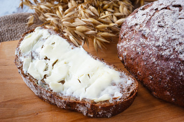 Fresh sliced bread with butter on the wooden boards