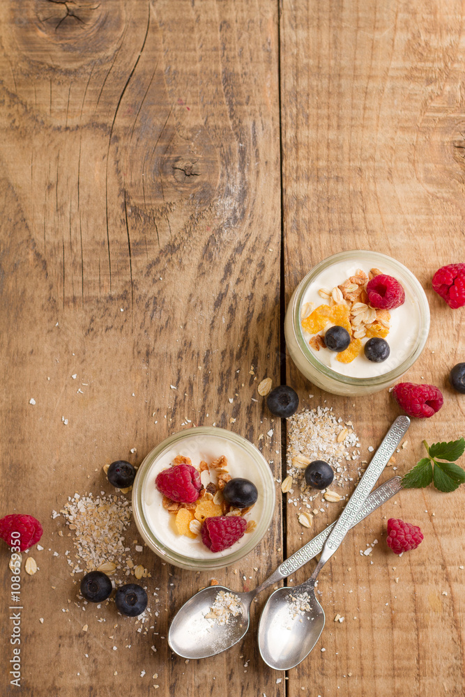 Wall mural yogurt with granola or muesli and fresh berries