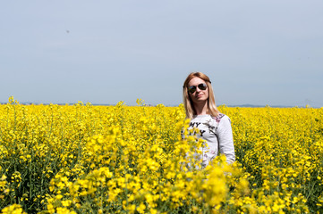 Woman in the colza field