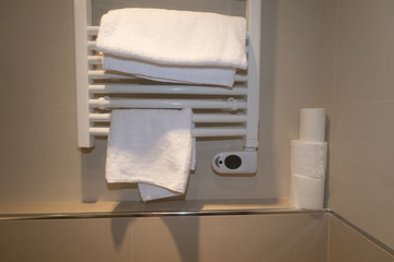 Obraz na płótnie Canvas bathroom heater with towels