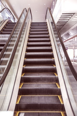Fototapeta premium Up and down escalators in public building