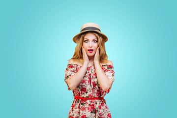 preety young woman ( girl ) in hat smiling and surprised on white background..