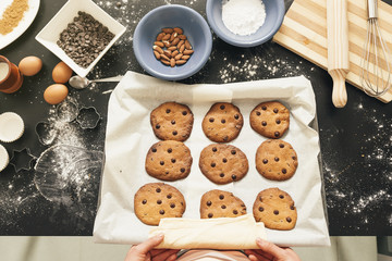 Beautiful woman Preparing Cookies And Muffins.