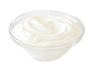 Fototapeta na wymiar Greek yogurt in a transparent bowl isolated on a white background