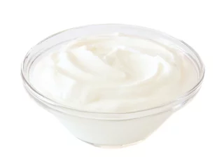 Gordijnen Greek yogurt in a transparent bowl isolated on a white background © Jenifoto