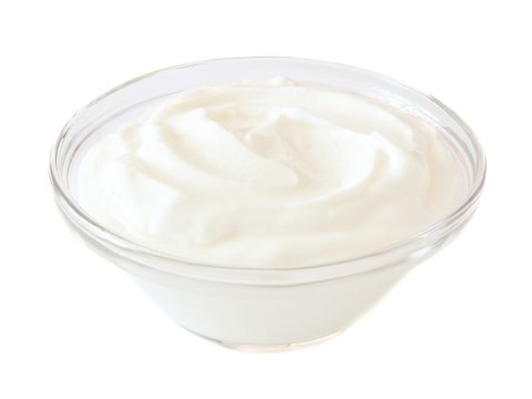 Greek Yogurt In A Transparent Bowl Isolated On A White Background