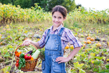 Girl with basket of vegetables
